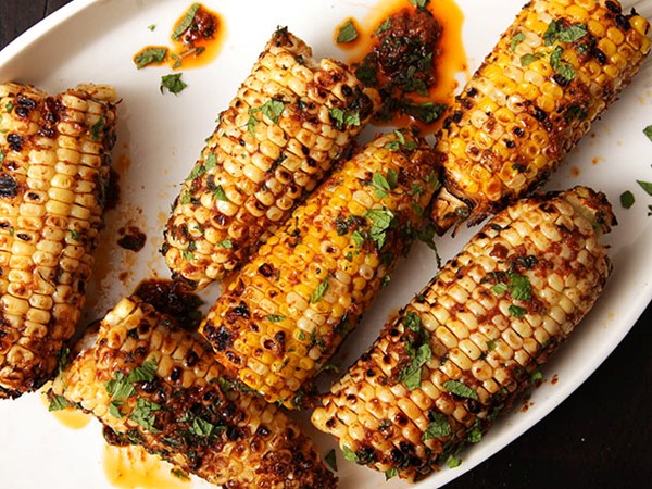 Grilled corn with harissa and mint