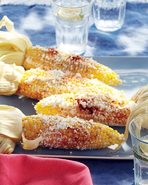 Grilled corn with sour cream and cotija cheese