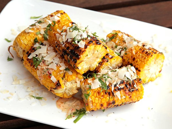 Grilled corn with spicy chili mayo, coconut, and fish sauce