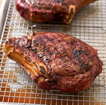 Grilled cowboy-cut rib eyes