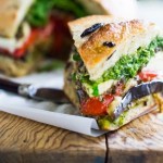 Grilled eggplant muffuletta sandwich