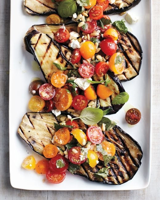 Grilled eggplant with tomatoes, basil, and feta