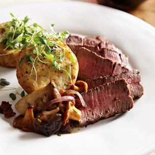 Grilled filets mignons with caramelized onion and mushroom sauce