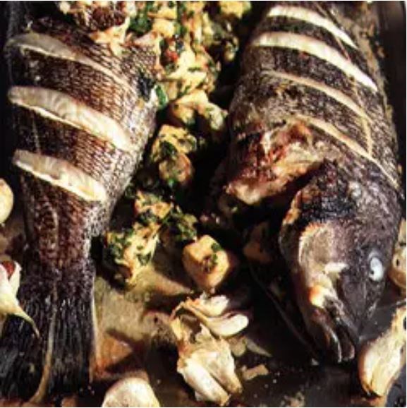 Grilled fish stuffed with seafood