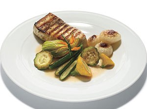 Grilled fish with crab-stuffed zucchini blossoms and white wine sauce