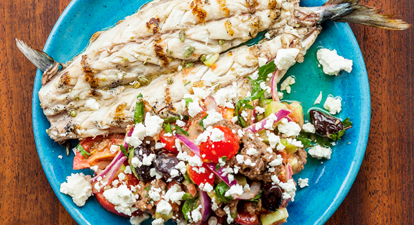 Grilled fish with Cretan rusk salad with tomato, oregano and feta