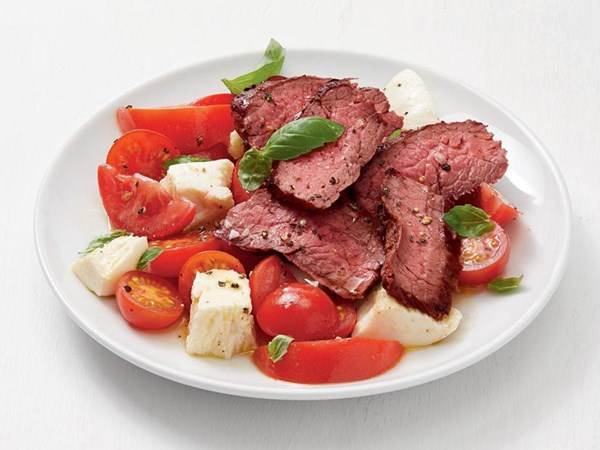 Grilled flank steak with mozzarella and basil