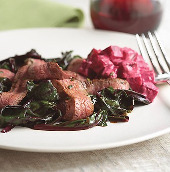 Grilled flank steak with sautéed beet greens and creamy horseradish beets