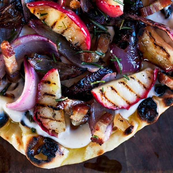 Grilled flatbreads with apples, bacon, and onion