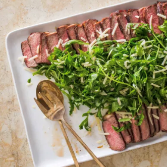 Grilled frozen steaks with arugula and Parmesan
