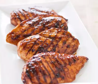 Grilled glazed bone-in chicken breasts