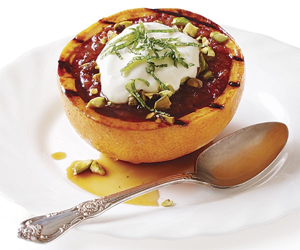 Grilled grapefruit halves with honey, brown sugar, and pistachios