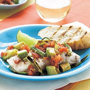 Grilled halibut with onion, spicy tomatoes, and avocado