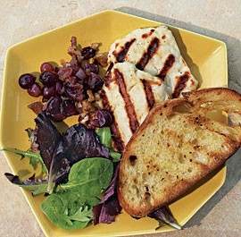 Grilled halloumi with rosemary-grape-walnut relish and garlic bread