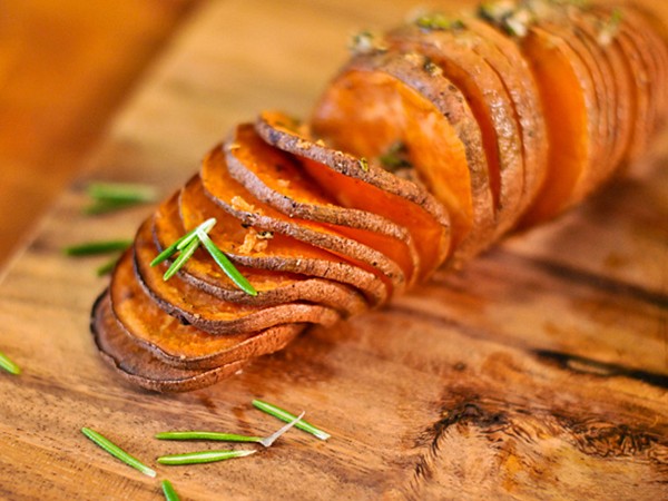 Grilled Hasselback sweet potatoes with rosemary and garlic