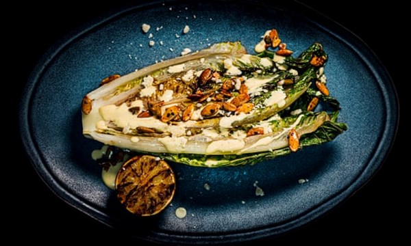 Grilled hearts of romaine with chilli pumpkin seeds