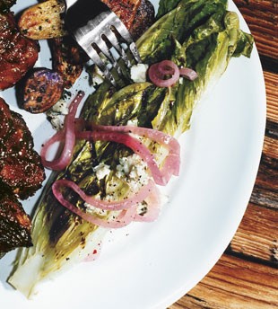 Grilled hearts of romaine with blue cheese vinaigrette and pickled onions