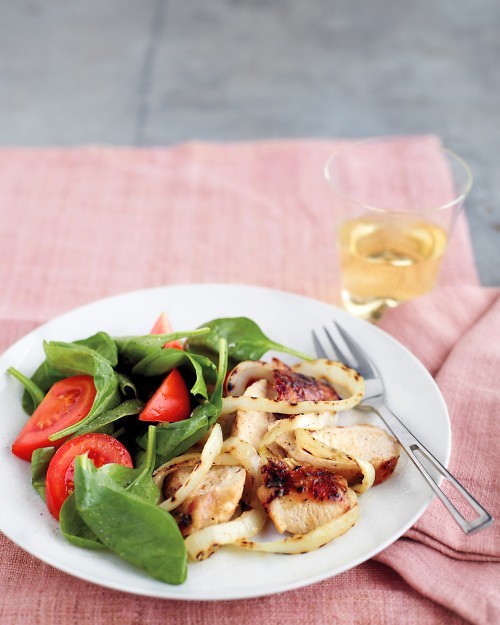 Grilled honey-mustard chicken with onions and spinach salad