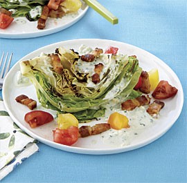 Grilled iceberg wedges with tomato, bacon, and blue cheese