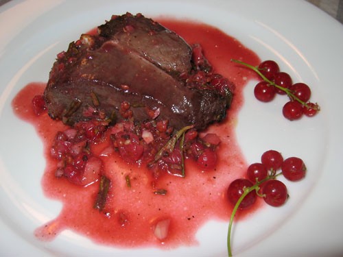 Grilled lamb chops in red currant and rosemary sauce
