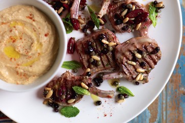 Grilled lamb cutlets with olives, mint and white bean puree
