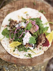 Grilled lamb kofta kebabs with pistachios and spicy salad wrap