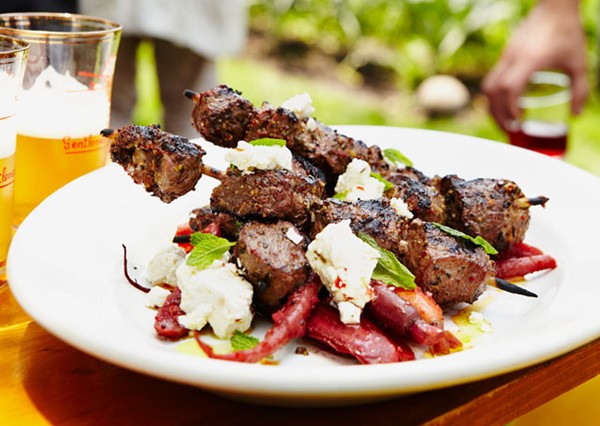 Grilled lamb skewers with carrots, feta, and mint