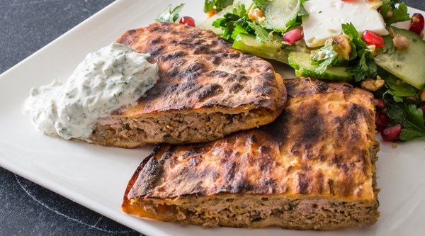 Grilled lamb-stuffed pitas with yogurt sauce
