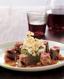 Grilled lamb tenderloins with curried golden raisins and a spinach timbale