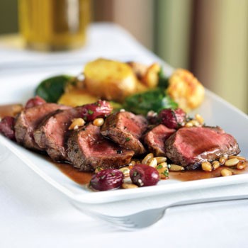 Grilled lamb with curried vegetables and grape and pine nut gremolata