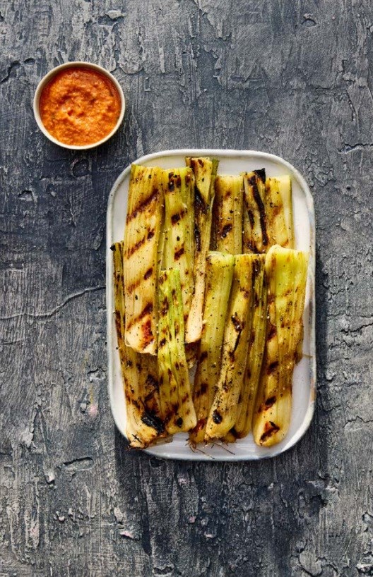 Grilled leeks with romesco sauce
