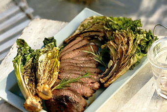 Grilled leg of lamb with curly endive and romaine