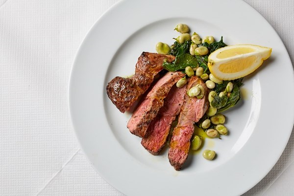 Grilled leg of lamb with spinach and broad beans