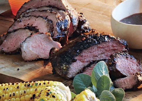 Grilled leg of lamb with red wine, garlic, mustard, and sage