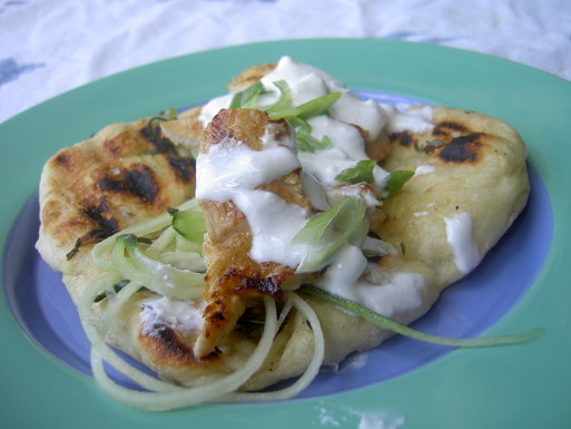 Grilled lemon chicken with feta dressing on grilled thyme bread