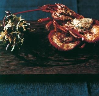 Grilled lobster with flavoured butter and herb salad