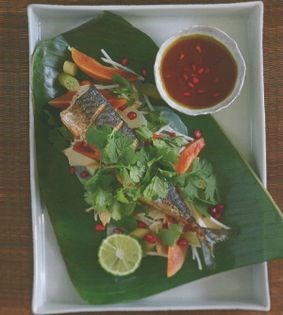Grilled mackerel on fruit and vegetables with pomegranate wasabi dressing