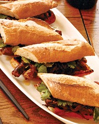 Grilled merguez sandwiches with caramelized red onions