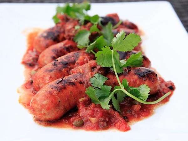 Grilled Mexican chorizo with spicy tomato caper sauce