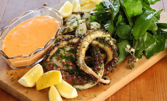 Grilled octopus in herb paste with rouille