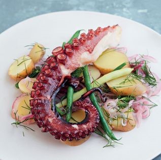 Grilled octopus with potato, bean, onion and dill salad