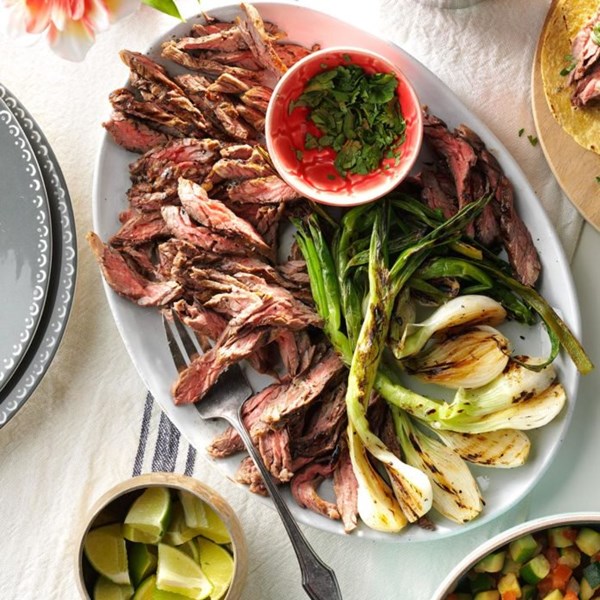Grilled onion & skirt steak tacos