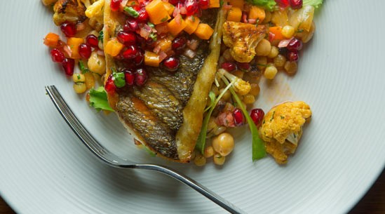 Grilled orata with cauliflower, fregola, and persimmon-pomegranate salsa
