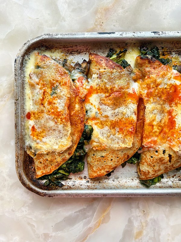 Grilled pancakes with harissa cabbage and Taleggio