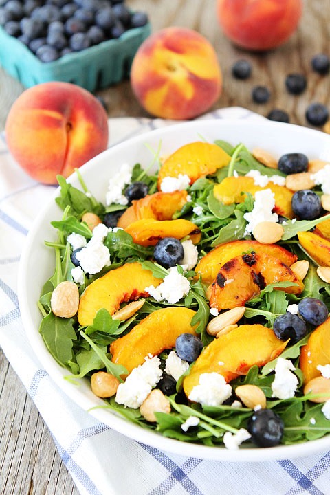 Grilled peach, blueberry, and goat cheese arugula salad