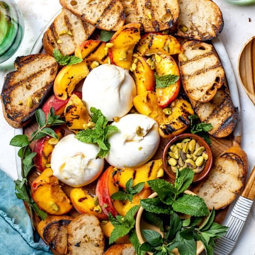 Grilled peaches with burrata, honey, and pistachios