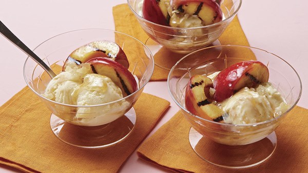 Grilled peaches with maple-cardamom butter and ginger ice cream