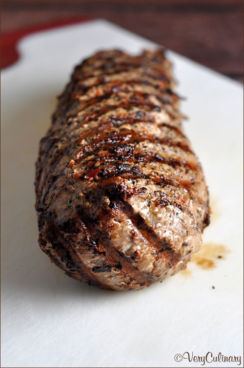 Grilled peppercorn and garlic pork tenderloin with herb butter