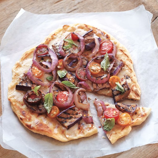 Grilled pizza with eggplant and tomatoes