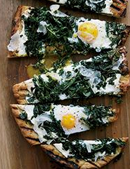 Grilled pizza with greens and eggs